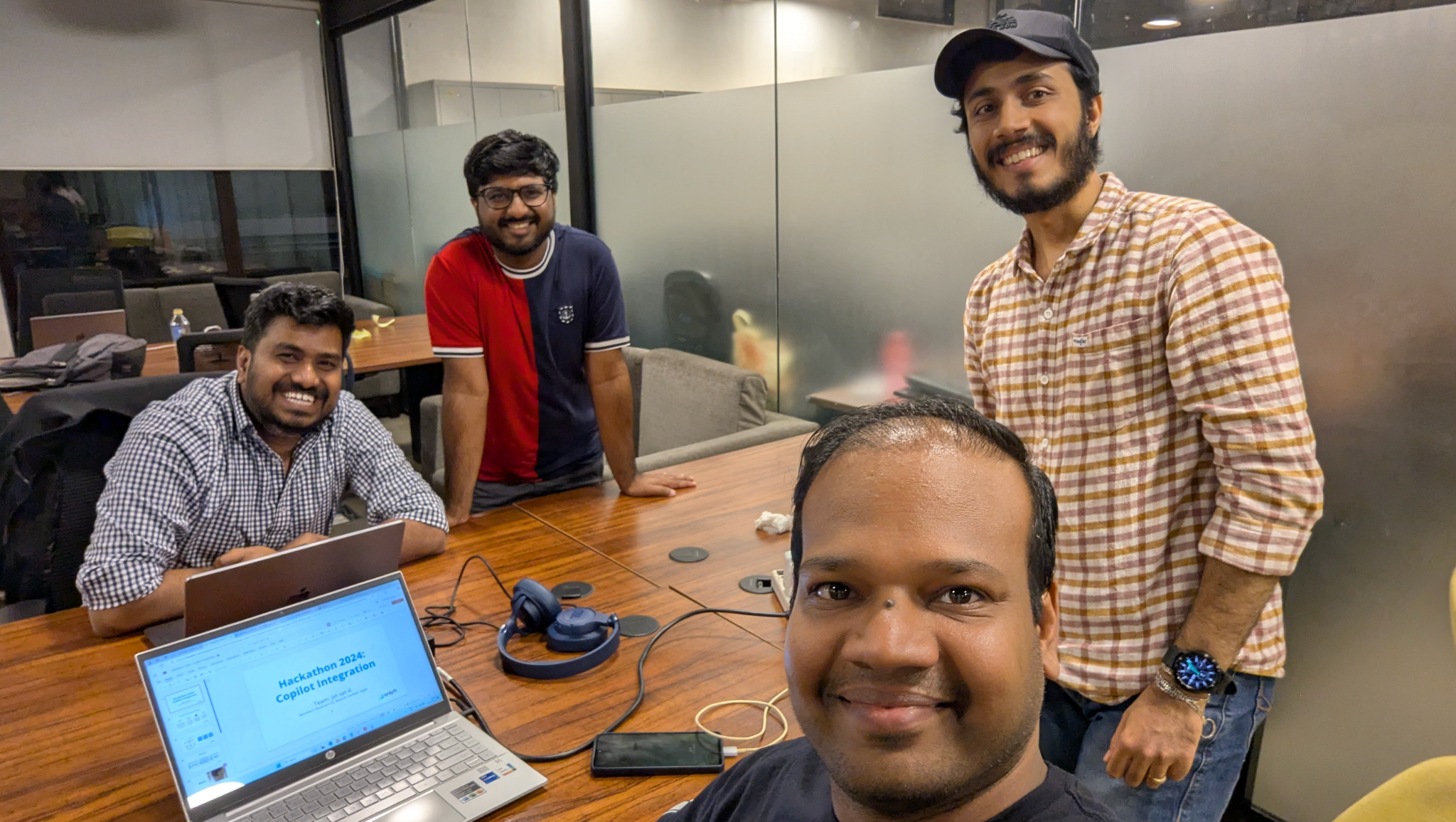 Teams preparing for their final presentations - engineers and designers rehearsing demos and finalizing slides for the hackathon showcase
