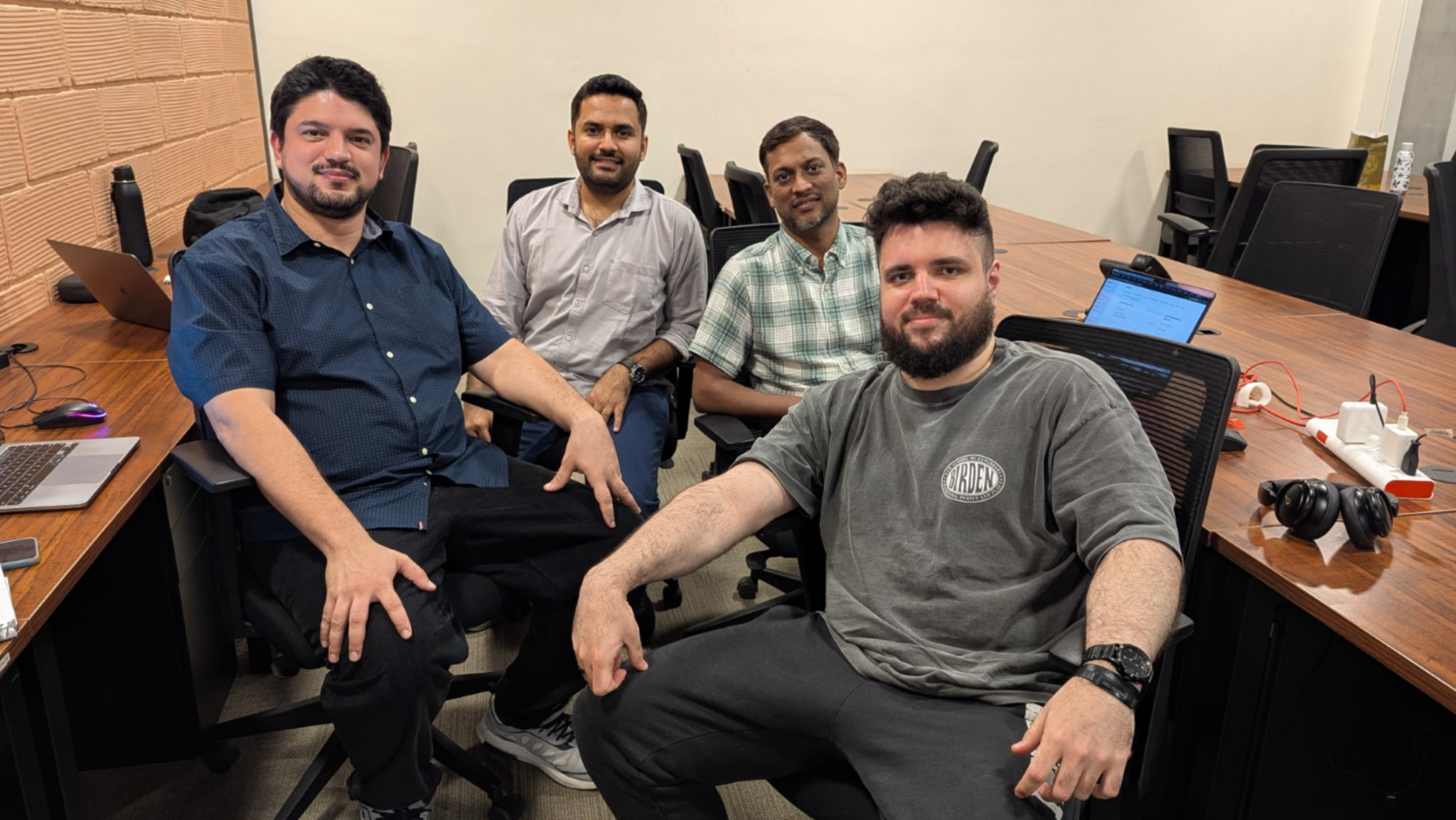Hackathon participants collaborating and coding during the event - engineers working intensely on their project implementations