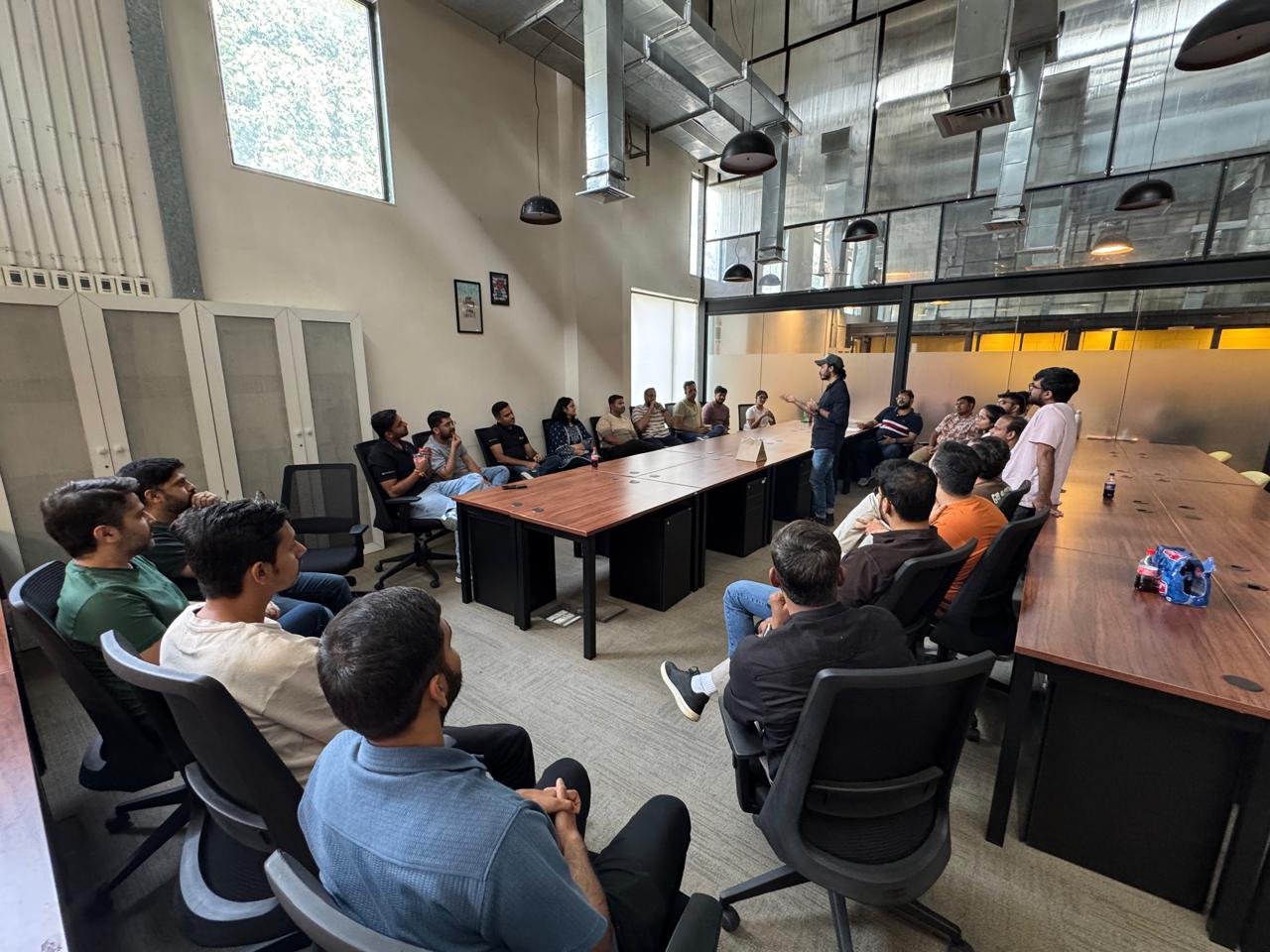 Team gathering at a table for a speech